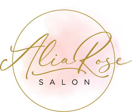 Logo for Alia Rose Salon. Gold script text on pink watercolor circle, with gold border. 